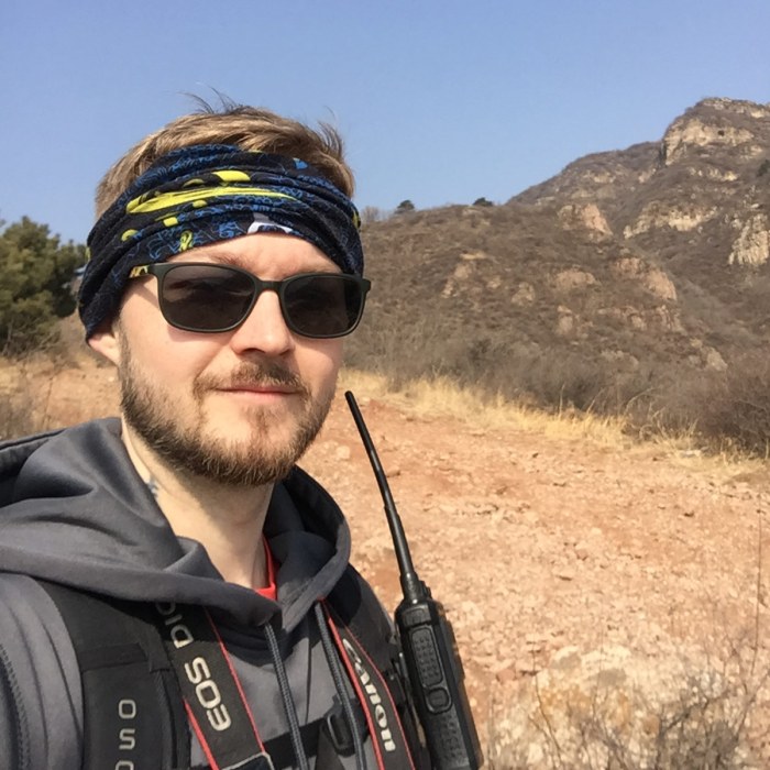 Trainer John Alsobrooks navigating during a hiking trip